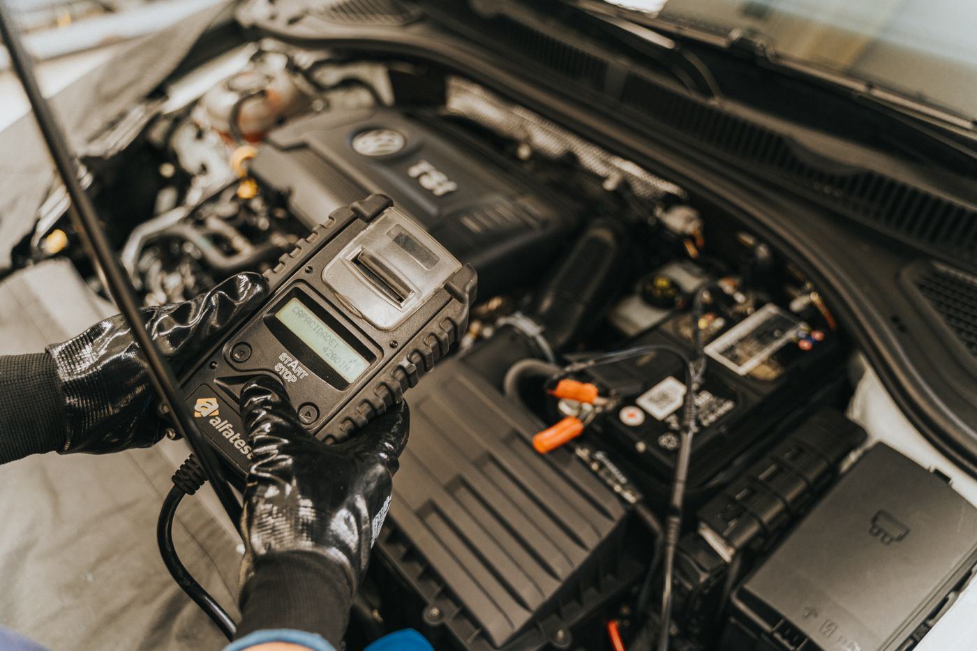 Al-Bayyan technician performing engine diagnostics